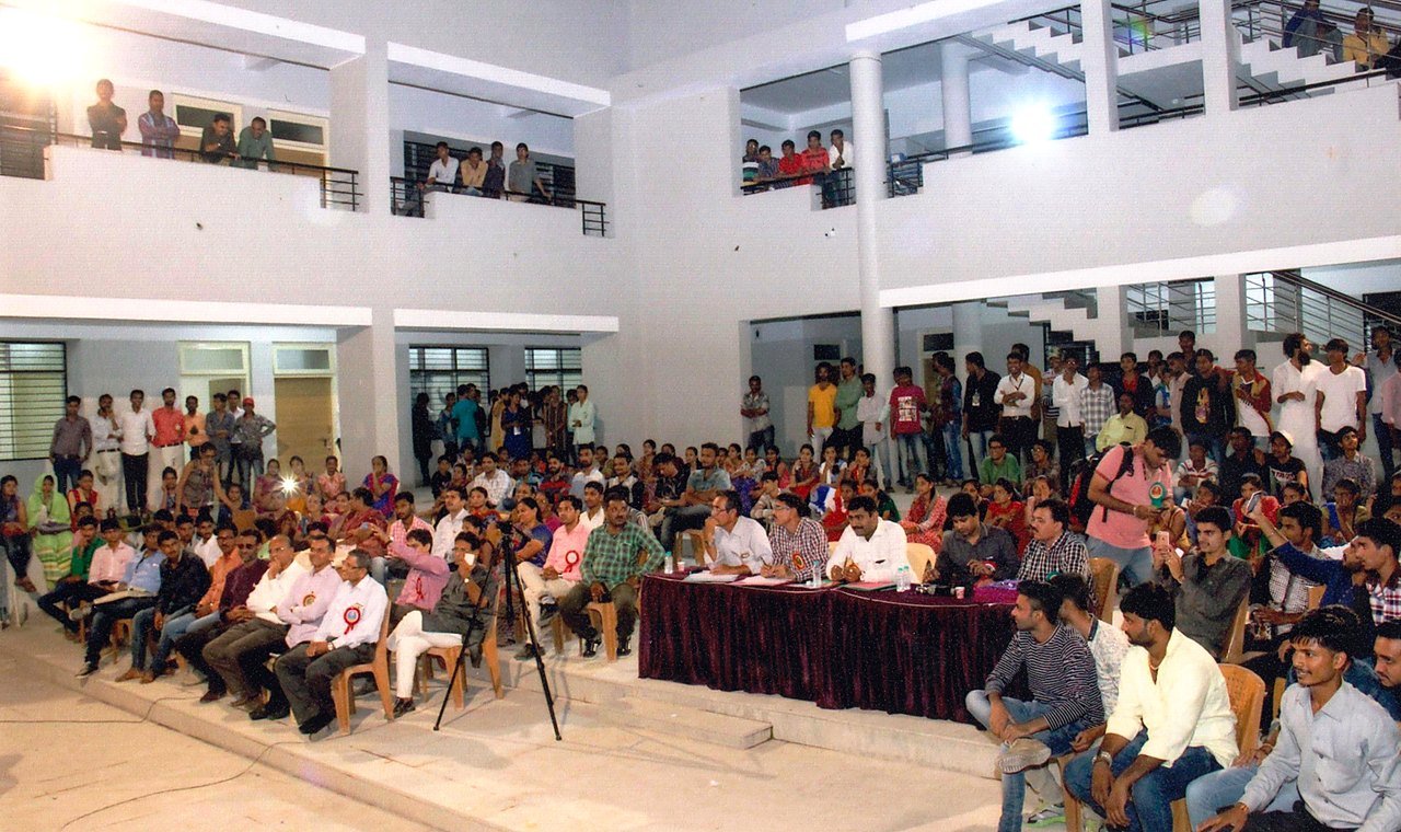 Auditorium gathering representing self-financed commerce expansion