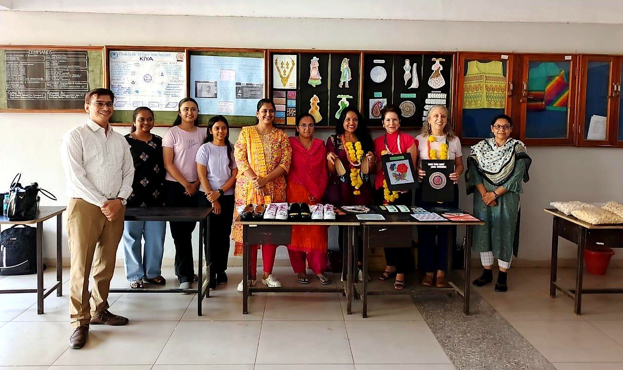 Fashion designing students and faculty displaying design work